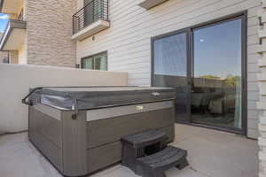 Patio / terrace with a patio area and a hot tub