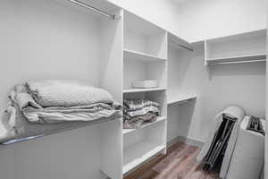 Walk in closet featuring light wood-type flooring