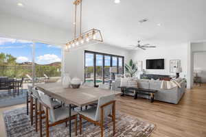 Dining room with recessed lighting, light wood-style flooring, and a ceiling fan