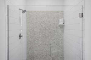 Full bath with a shower stall