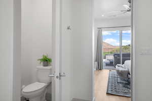 Bathroom featuring a ceiling fan, a mountain view, light wood-type flooring, and recessed lighting
