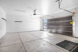 Garage featuring baseboards