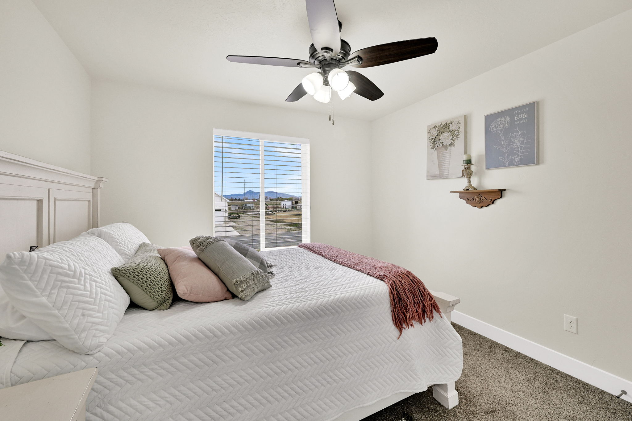 Bedroom featuring carpet flooring and ceiling fan