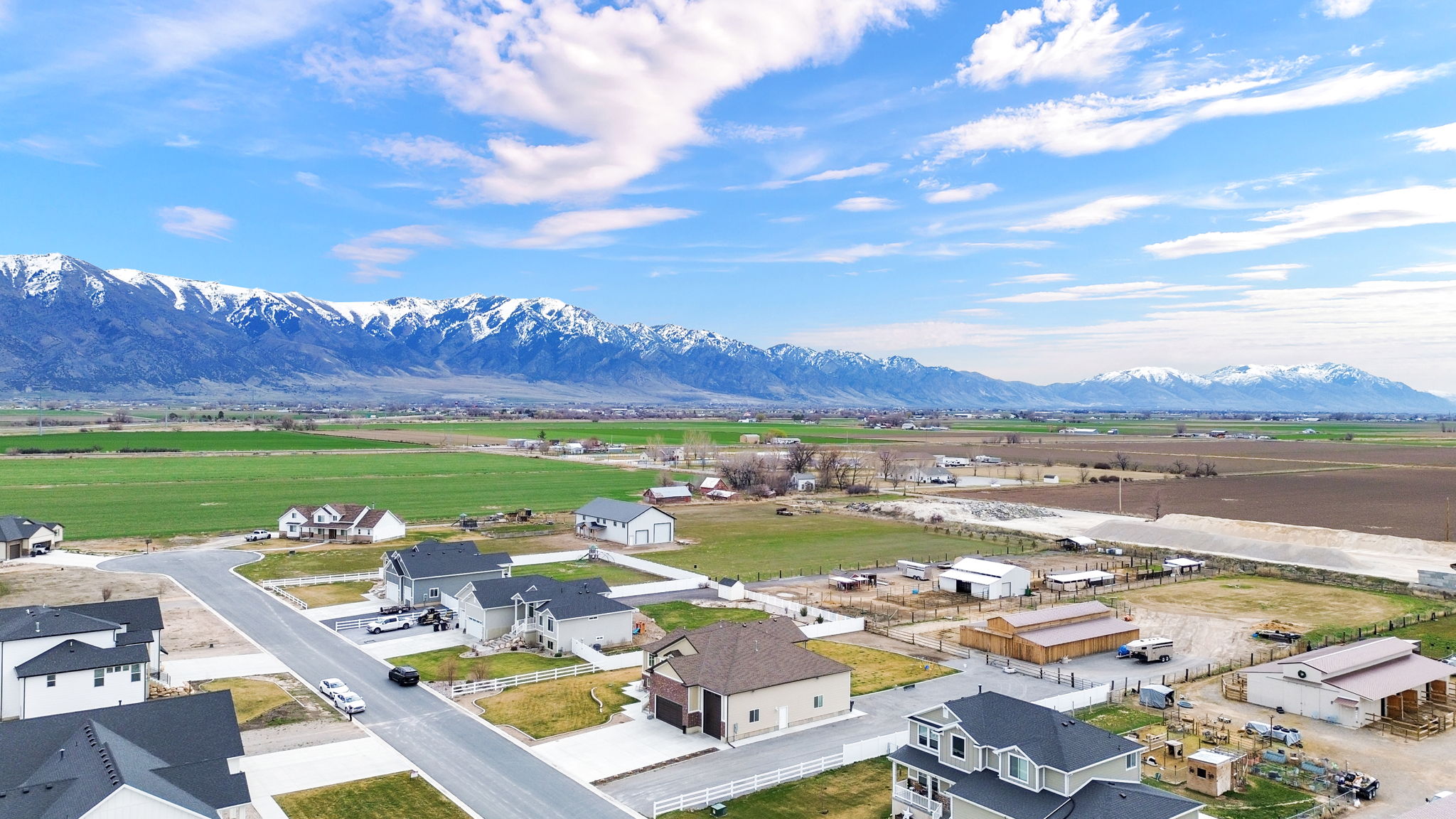 Aerial view of residential area featuring a mountainous background