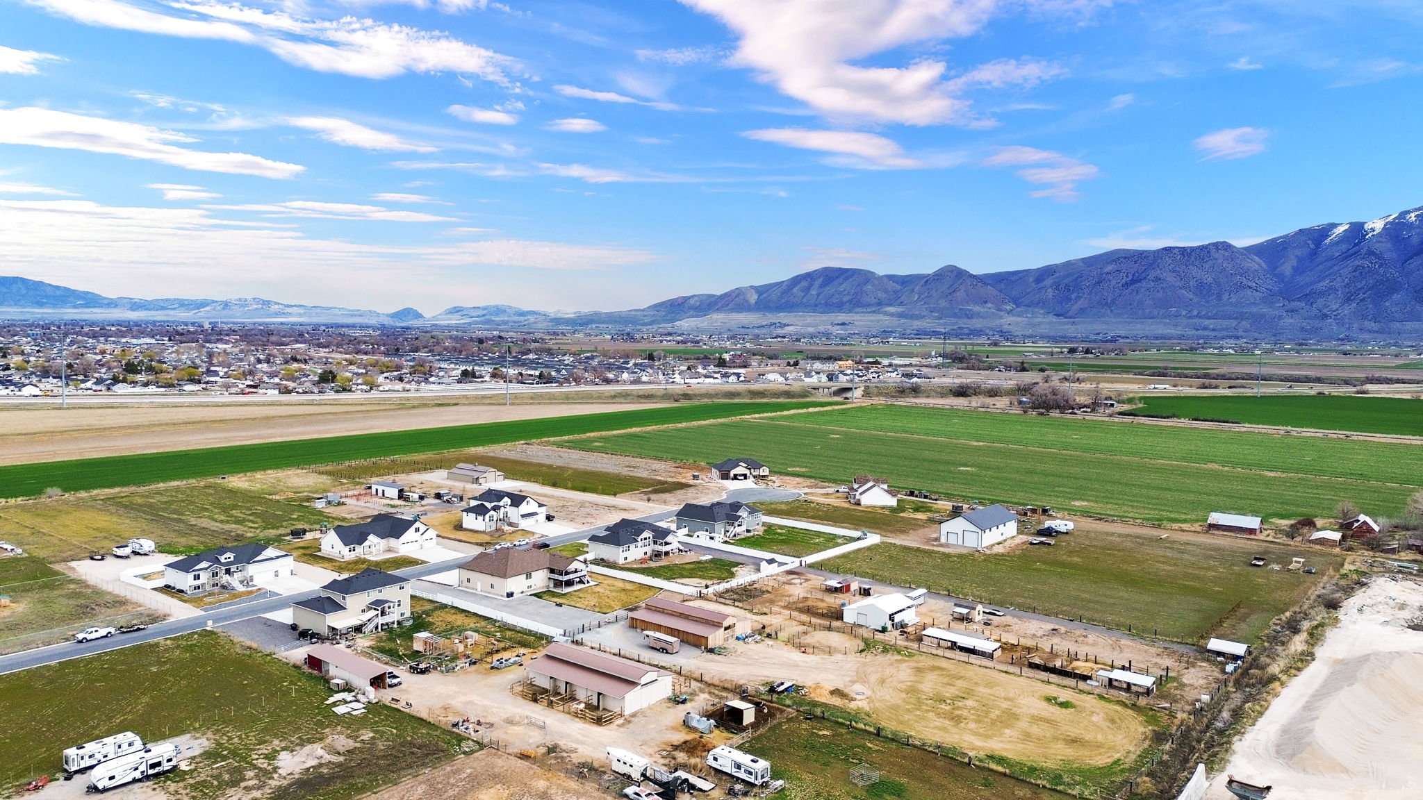 Aerial perspective of suburban area featuring a mountain backdrop