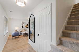 Stairs featuring baseboards and wood finished floors