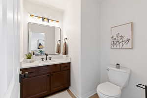 Half bath with vanity and toilet