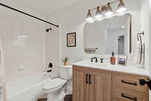 Full bathroom featuring vanity and shower / bath combo with shower curtain