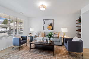 Living room with wood finished floors and baseboards