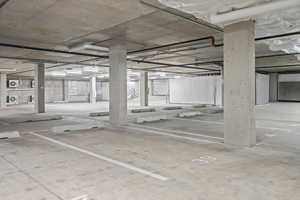 Garage featuring a parking garage