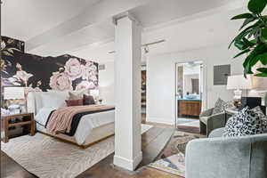 Bedroom with an accent wall and electric panel