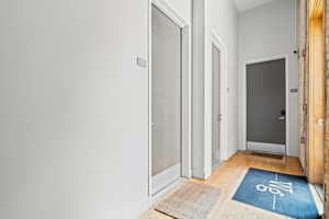 Full bath with light wood-style floors