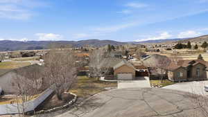 View of mountain background featuring nearby suburban area