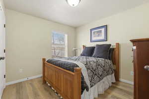 Bedroom featuring LVP flooring and ceiling fan