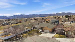 Aerial view of residential area featuring a mountainous background