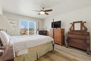 Bedroom featuring light wood finished floors and a ceiling fan