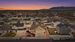 Aerial view at dusk of a residential view and a mountain view