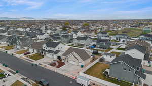 Aerial perspective of suburban area featuring a mountainous background