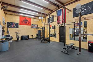 Gym with a high ceiling and a heating unit