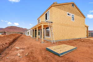 View of property exterior with a mountain view