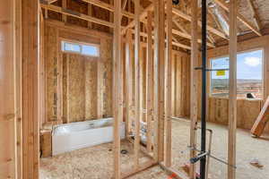 Full bath featuring a garden tub