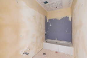Bathroom featuring a tub to relax in