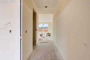 Hallway with a textured ceiling