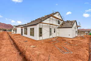 Rear view of property featuring a mountain view