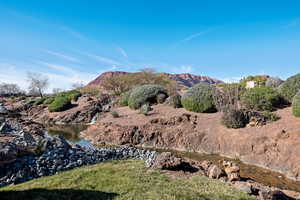 View of mountain backdrop with a nearby body of water