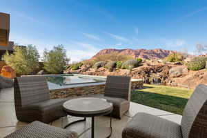 View of patio / terrace featuring a mountain view and an outdoor pool