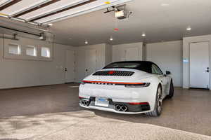 Garage featuring a garage door opener