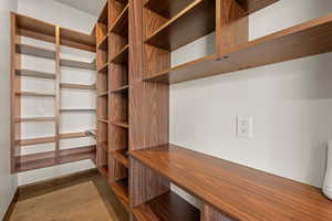 Walk in closet featuring light wood-type flooring