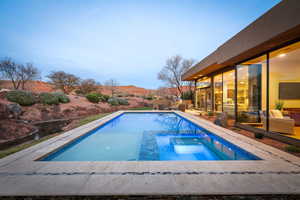 Integrated pool / spa featuring a patio