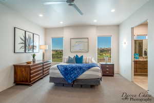 Bedroom with light carpet, ensuite bath, recessed lighting, and a ceiling fan