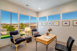Office area with carpet flooring, a mountain view, and recessed lighting