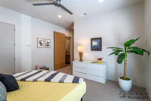 Bedroom featuring light colored carpet, connected bathroom, ceiling fan, and recessed lighting