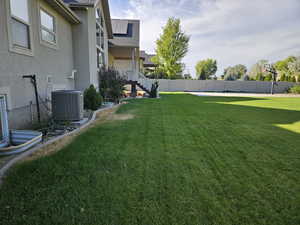 Fenced yard featuring a patio