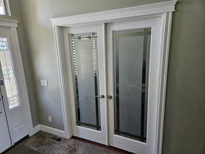 Foyer with french doors and healthy amount of natural light