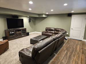 Living area featuring recessed lighting and a textured ceiling