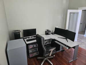 Office area with dark wood-style floors