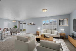 Living area featuring baseboards and hanging lights
