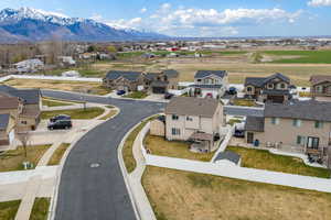 Aerial view of residential area featuring a mountainous background