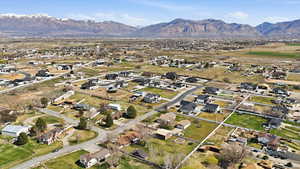 Aerial overview of property's location featuring nearby suburban area