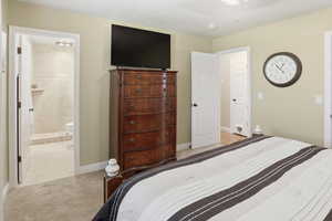 Primary ensuite bedroom with walk in closet