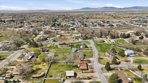 View of property location featuring nearby suburban area and a mountain backdrop