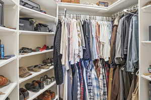 Primary ensuite bedroom with walk in closet