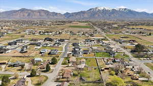 Aerial view of residential area featuring a mountainous background