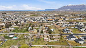 Aerial view of residential area featuring a mountain backdrop