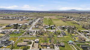 View of rural area with nearby suburban area and mountains