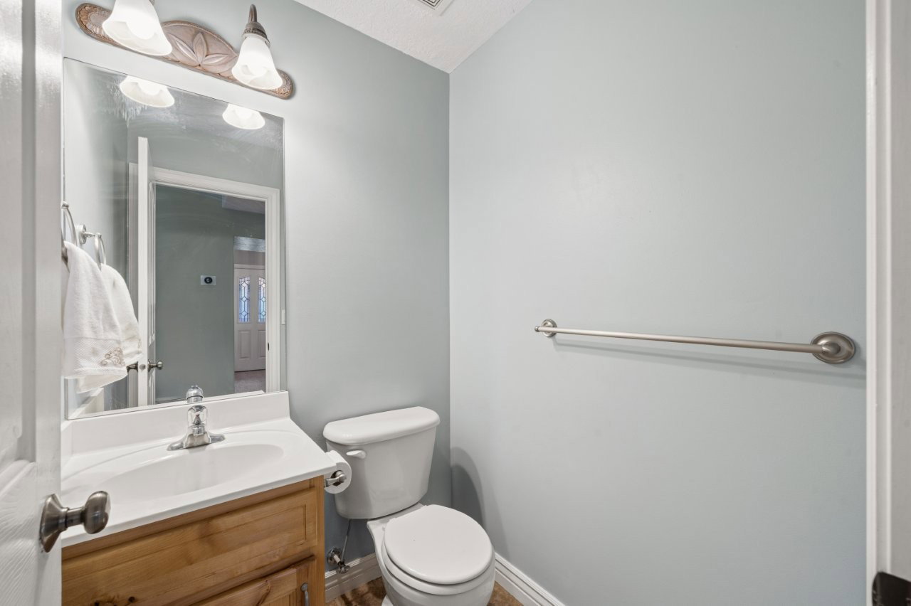 Half bath with vanity and toilet